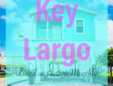 Teal colored rental home exterior in Key Largo, Florida. The words "Key Largo, Listed at $4200 monthly" are featured in front.